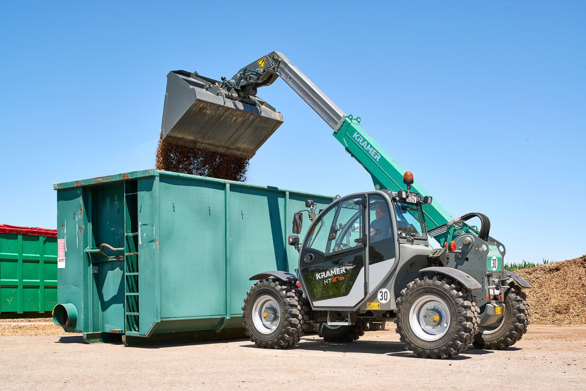 The Kramer telehandler KT276 while loading a container.
