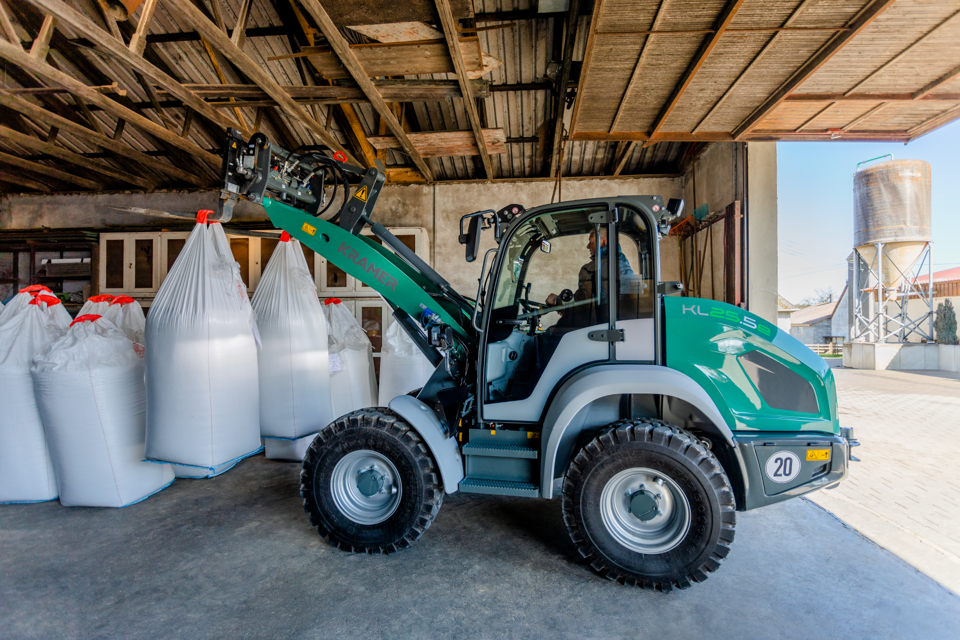 The fully electric Kramer wheel loader KL25.5e while transporting big bags.