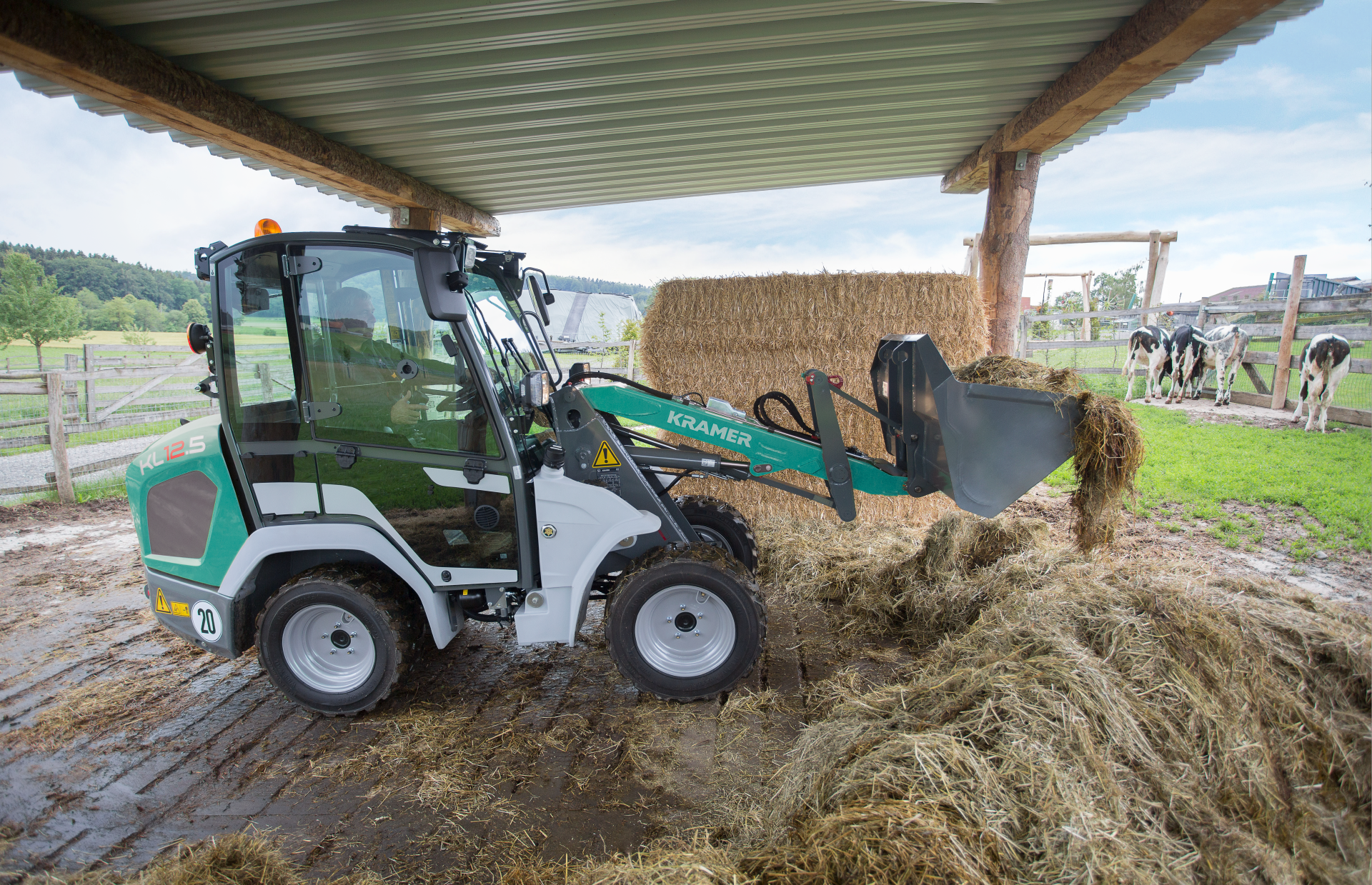 The compact KL12.5 while transporting dung.