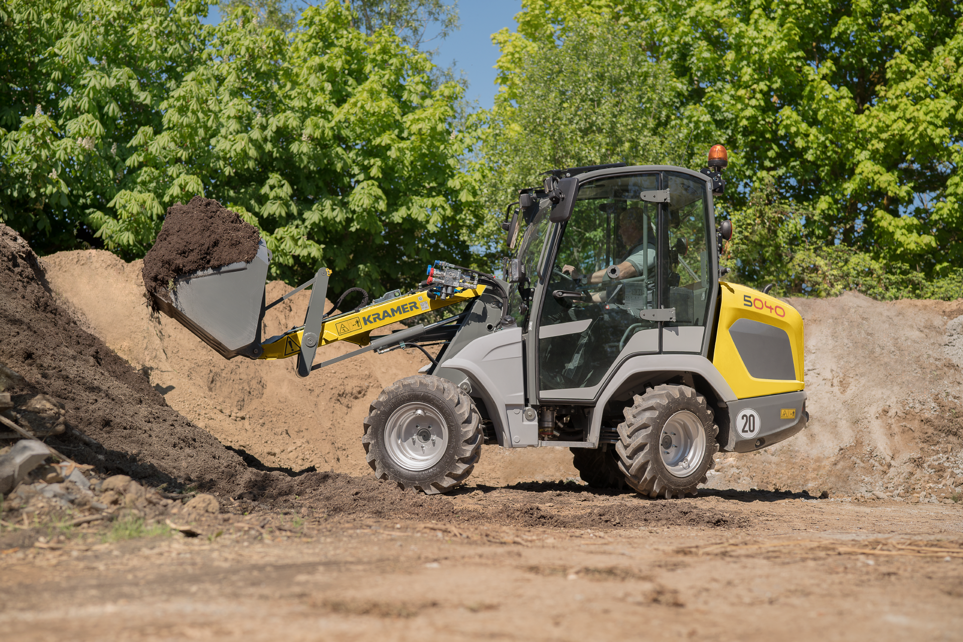 The compact 5040 while loading soil.