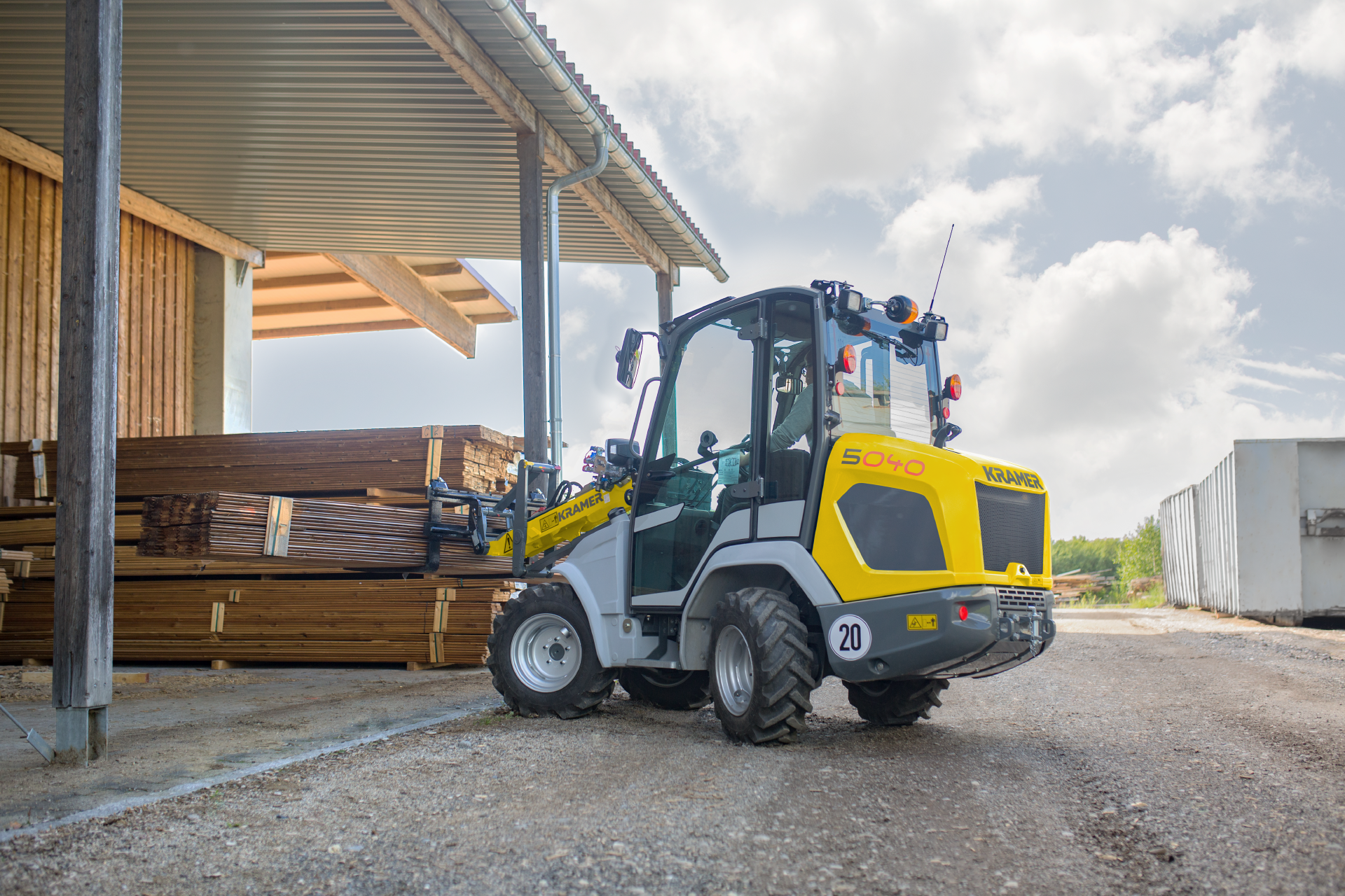 The compact 5040 while transporting wood.
