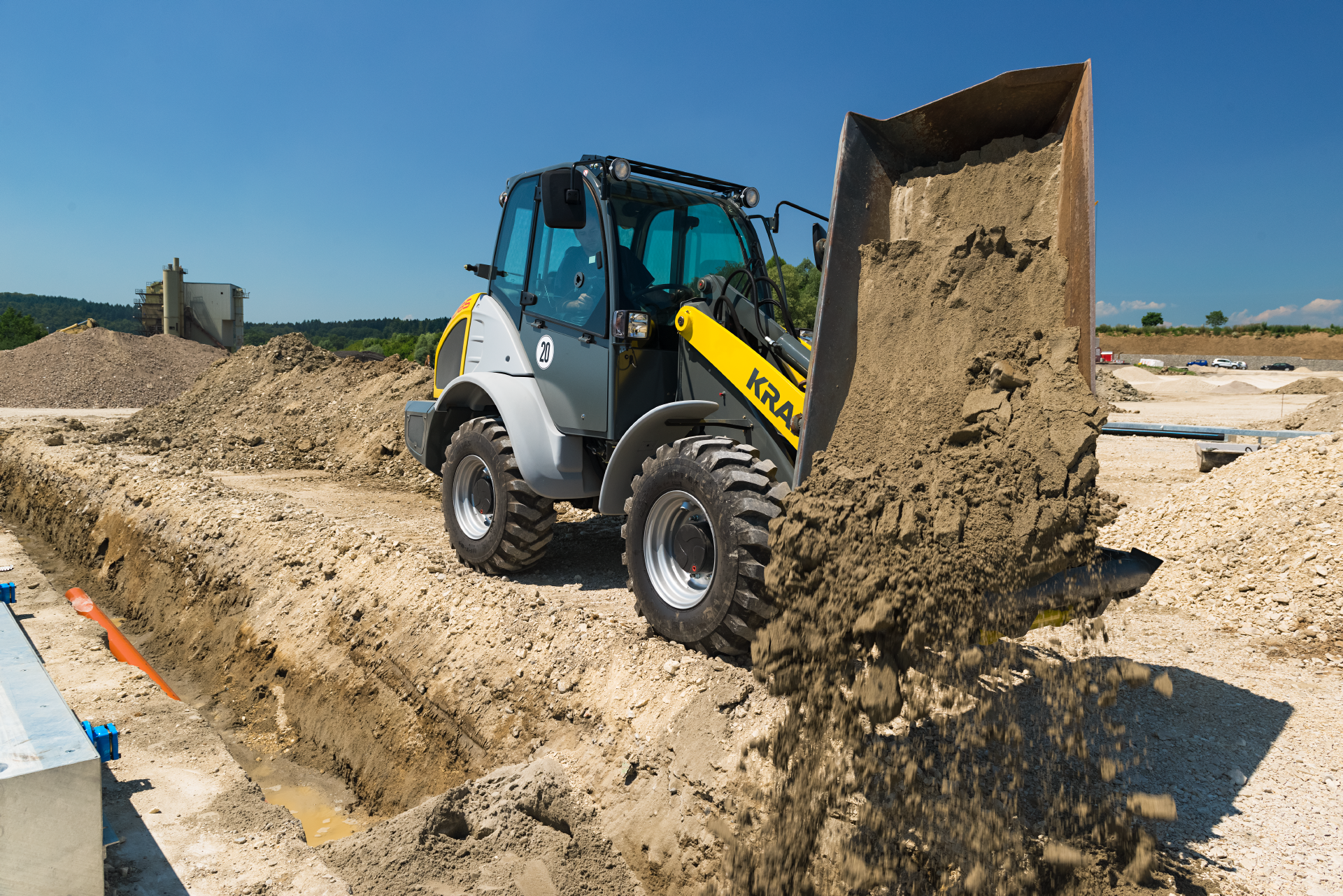 The Kramer wheel loader 5085 while working with soil.