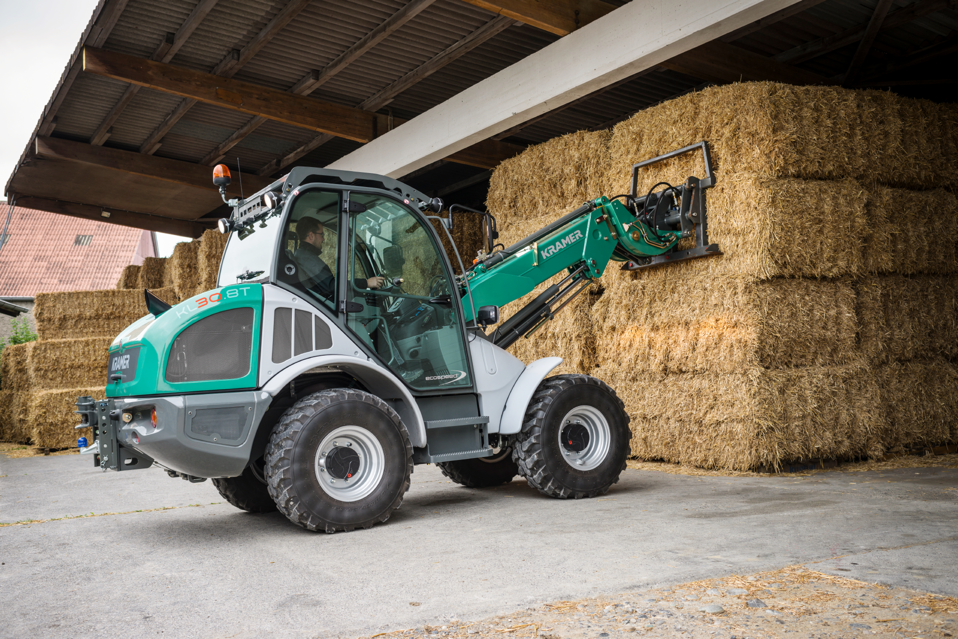 The Kramer telescopic wheel loader KL30.8T while stacking and loading.