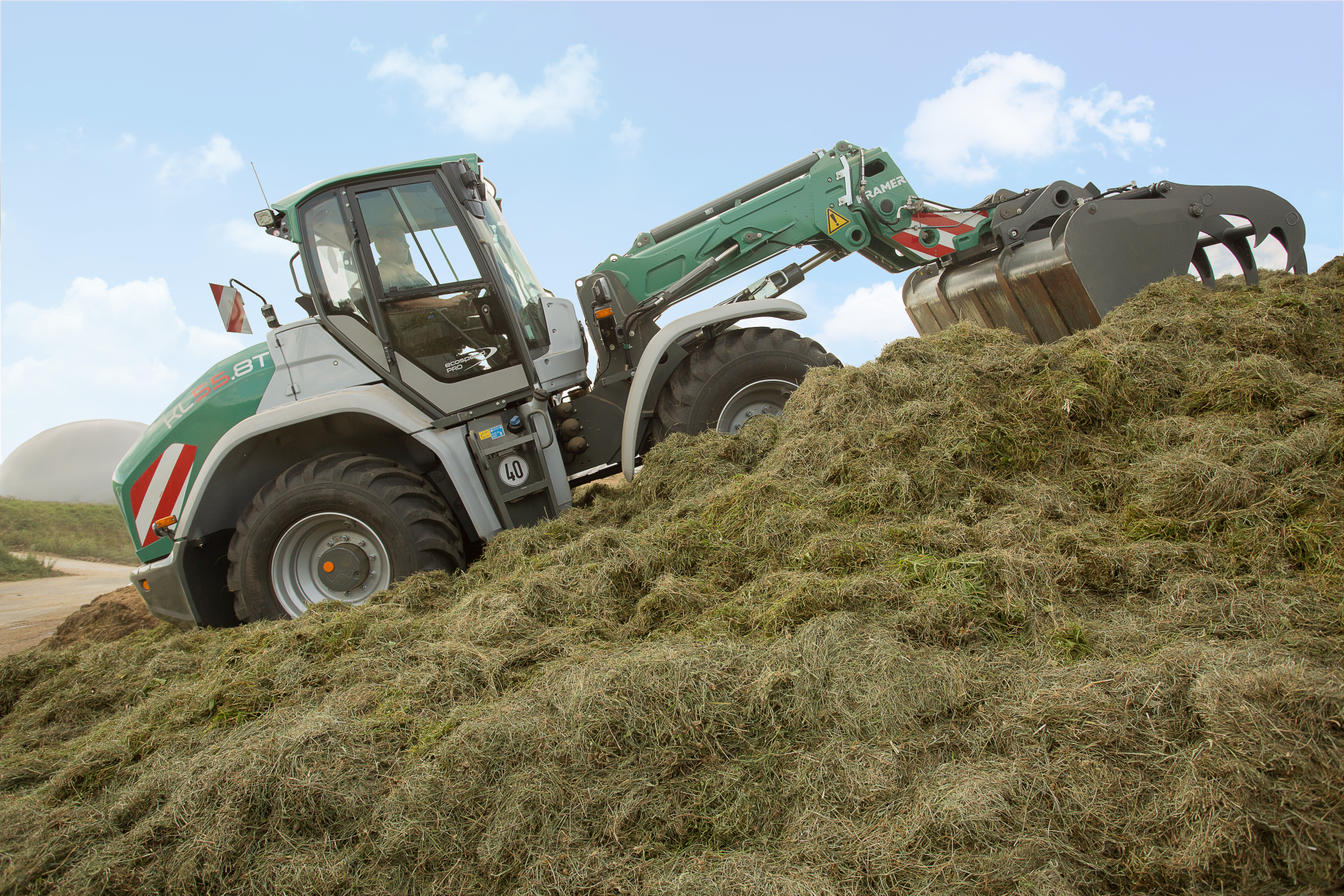 The Kramer telescopic wheel loader KL55.8T while working in a silage.